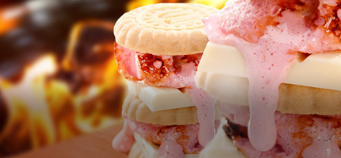 Shortbread cookies, white chocolate, strawberries & strawberry marshmallow s'mores with flames in background