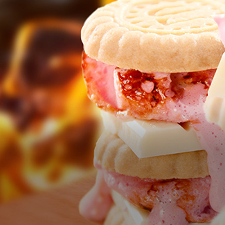 Shortbread cookies, white chocolate, strawberries & strawberry marshmallow s'mores with flames in background