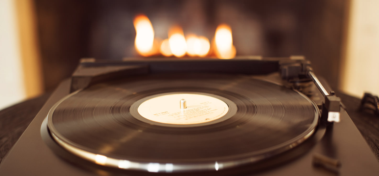 Record on a turntable with Duraflame fire burning in background