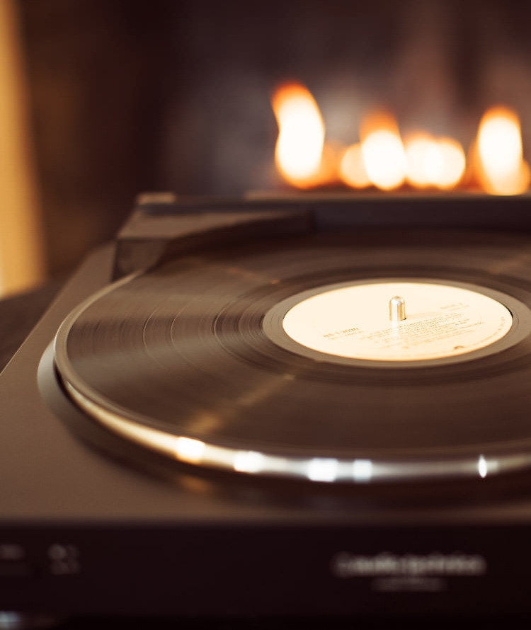 Record on a turntable with Duraflame fire burning in background