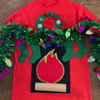 DIY Fireplace Ugly Sweater design with duraflame logo red flame, wreath and stockings