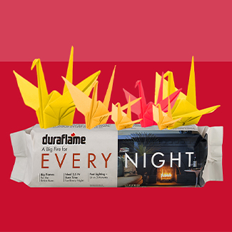 Duraflame Every Night firelog in packaging topped with oragami birds that look like flames
