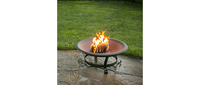 duraflame® 6lb 100% renewable firelog burning in firepit on patio