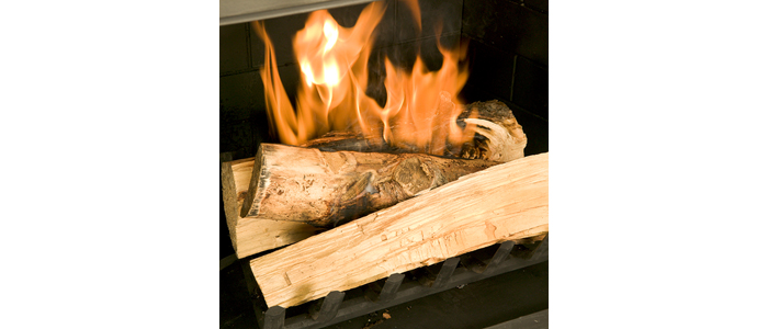 duraflame® firestart firelighter igniting a wood fire in a fireplace