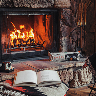 Indoor fire with book and Every Night firelog