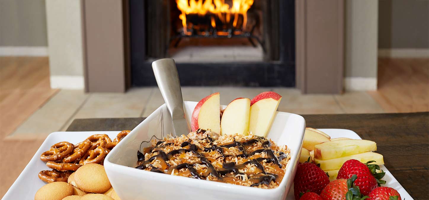 Cookie dip and fruit with a Duraflame fire burning in the background
