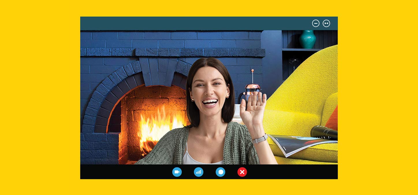 Image of woman smiling on a video call with a duraflame fire virtual background