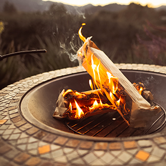 Duraflame OUTDOOR firelogs burning in an outdoor fire pit