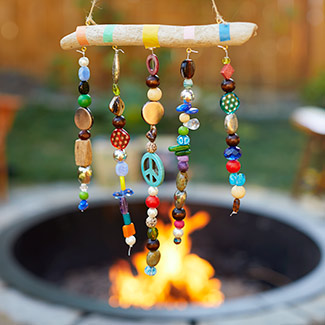 Handmade windchime with a campfire in the background