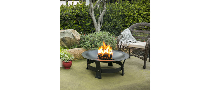 duraflame® 4.5lb firelog burning in backyard firepit
