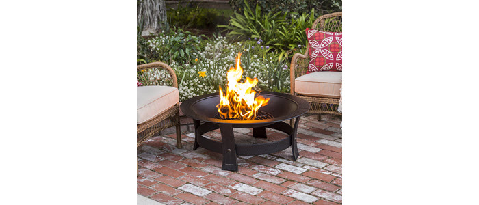 duraflame 2.5lb firelog burning in firepit on brick patio with chair